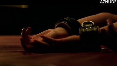 Blindfolded and handcuffed she has no escape