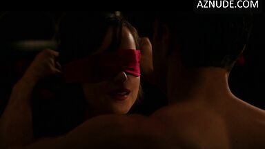 Blindfolded and handcuffed she has no escape