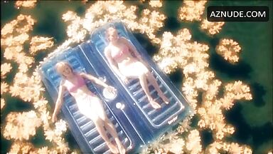 In a swimsuit in the middle of the lake