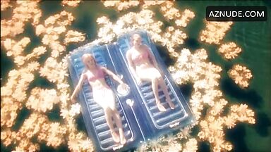 In a swimsuit in the middle of the lake