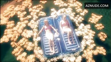 In a swimsuit in the middle of the lake