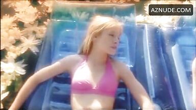 In a swimsuit in the middle of the lake