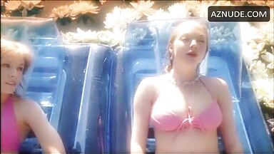 In a swimsuit in the middle of the lake