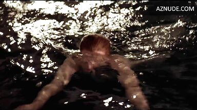 She comes out of the water with wet tits