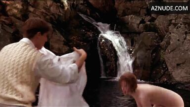 She comes out of the water with wet tits