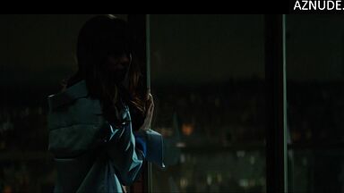 She goes out onto the balcony with her breasts bare