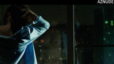 She goes out onto the balcony with her breasts bare