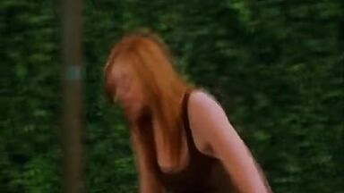 Mila Kunis in a swimsuit with her redhead friend