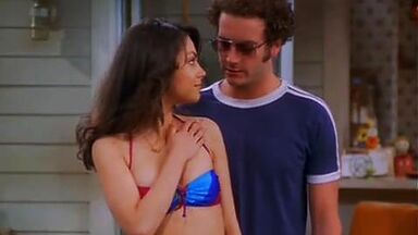 Mila Kunis in a swimsuit with her redhead friend