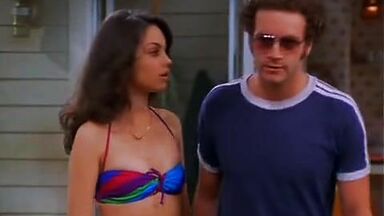 Mila Kunis in a swimsuit with her redhead friend