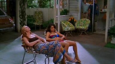 Mila Kunis in a swimsuit with her redhead friend