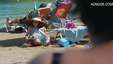 Dakota Johnson at the beach with her daughter