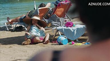 Dakota Johnson at the beach with her daughter