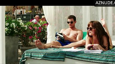 Dakota Johnson takes off her swimsuit