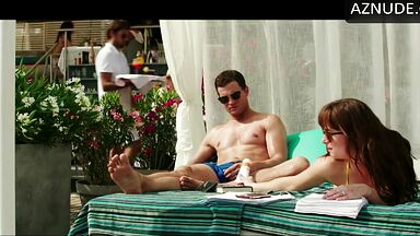 Dakota Johnson takes off her swimsuit