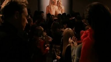 Watching her own nude portrait