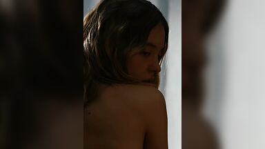 Showing her back