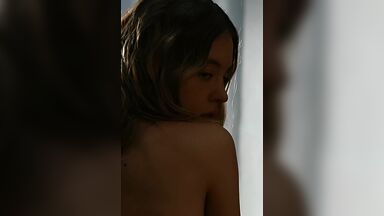 Showing her back