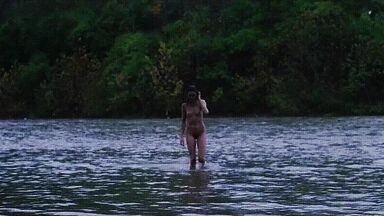 Washing naked on river