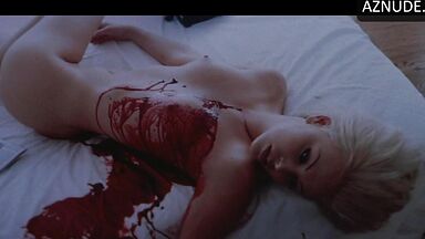 Charlize Theron with a naked body and tits on display