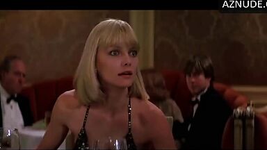 Michelle Pfeiffer she looks sexy at a restaurant table
