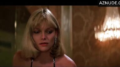Michelle Pfeiffer she looks sexy at a restaurant table