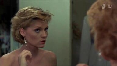 Michelle Pfeiffer coming from the shower in a towel