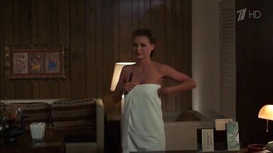Michelle Pfeiffer coming from the shower in a towel