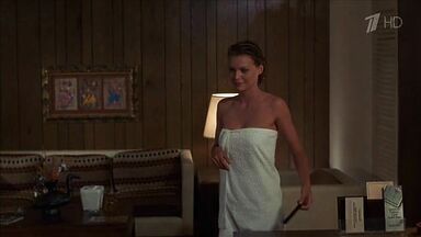 Michelle Pfeiffer coming from the shower in a towel