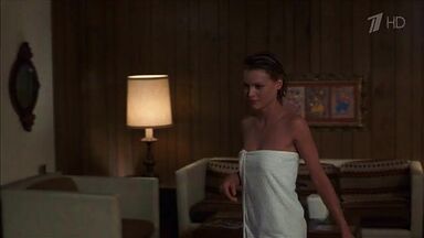 Michelle Pfeiffer coming from the shower in a towel
