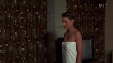 Michelle Pfeiffer coming from the shower in a towel
