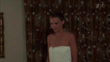 Michelle Pfeiffer coming from the shower in a towel