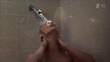 Michelle Pfeiffer coming from the shower in a towel