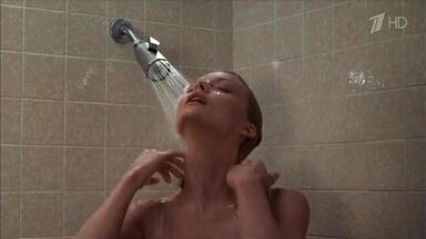 Michelle Pfeiffer coming from the shower in a towel