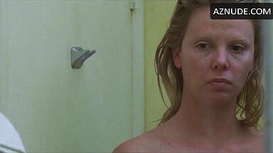 Charlize Theron undressed in front of the mirror