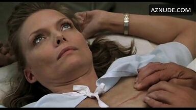 Michelle Pfeiffer palpated by a doctor