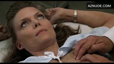 Michelle Pfeiffer palpated by a doctor