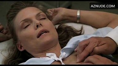 Michelle Pfeiffer palpated by a doctor