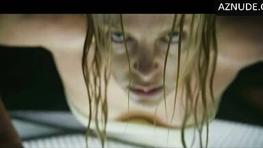 Charlize Theron does push-ups while wet