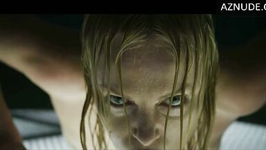 Charlize Theron does push-ups while wet