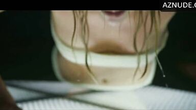 Charlize Theron does push-ups while wet