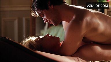 Charlize Theron she is being ridden by a man