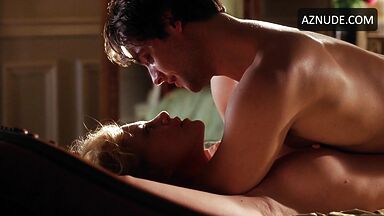 Charlize Theron she is being ridden by a man