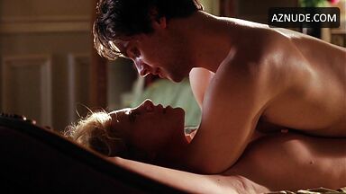 Charlize Theron she is being ridden by a man