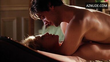 Charlize Theron she is being ridden by a man