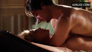 Charlize Theron she is being ridden by a man