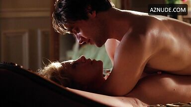 Charlize Theron she is being ridden by a man