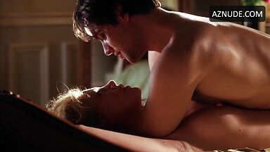 Charlize Theron she is being ridden by a man