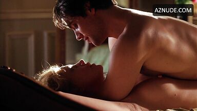 Charlize Theron she is being ridden by a man