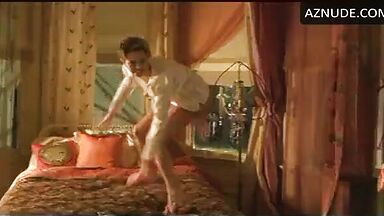 Charlize Theron having fun at the head of the bed